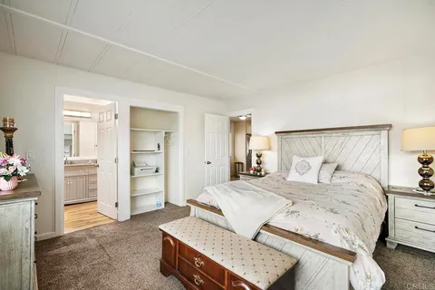 a bathroom with double vanity sinks and a mirror
