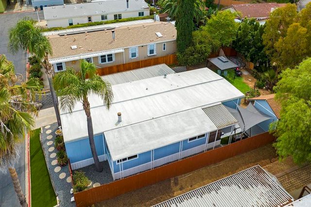 an aerial view of a house with a swimming pool