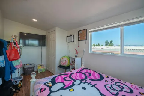 a bedroom with a bed and a cabinets