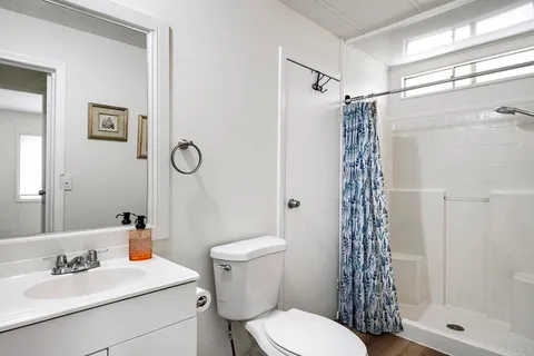 a view of a house with backyard and porch