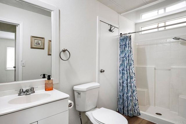 a view of a house with backyard and porch