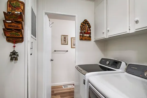 a view of a patio with table and chairs with wooden fence and floor