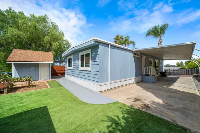 an aerial view of a houses with a swimming pool