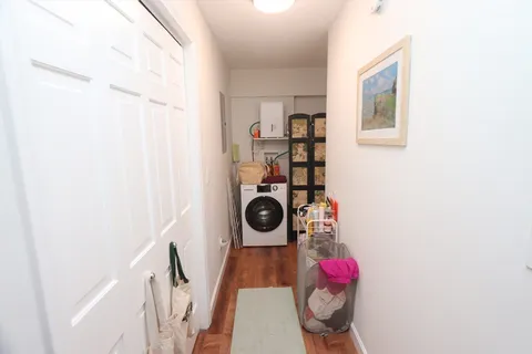 a hallway with washer and dryer