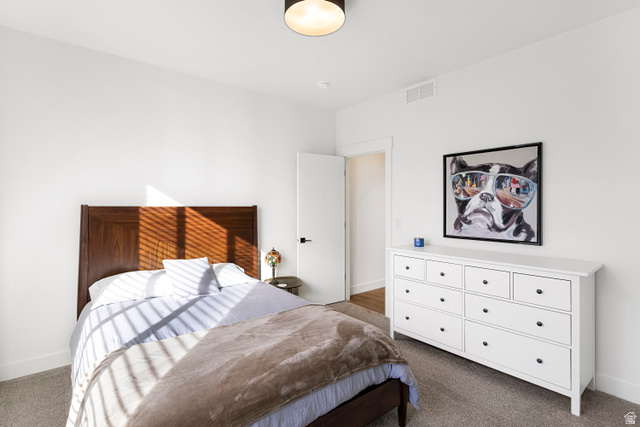 851 Grandview Drive Morgan, UT 84050 - Photo 24 of 68 Carpeted room with a dark wood-finish bed frame, white walls, and a ceiling-mounted light fixture