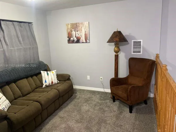 a living room with furniture and a couch