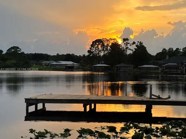 a view of swimming pool with a lake view