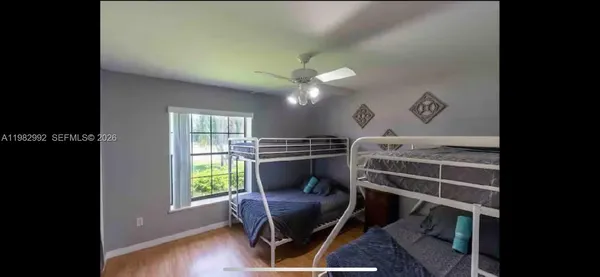a view of a livingroom with furniture and a ceiling fan