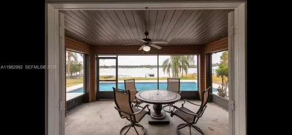 a view of a dining room with furniture window and outside view