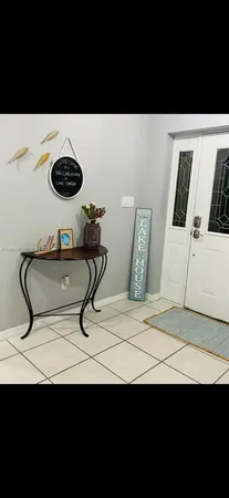 a kitchen view with a sink and a table