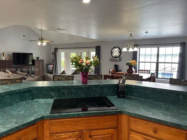 a kitchen with a sink and a large window