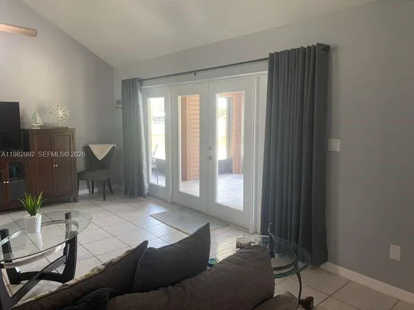 a living room with furniture and a window