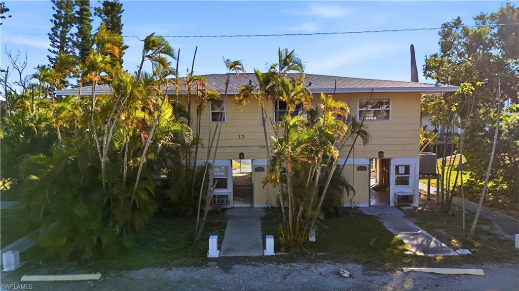 75 Mound Road Fort Myers Beach, FL 33931 - Photo 15 of 20 a view of a house with a tree