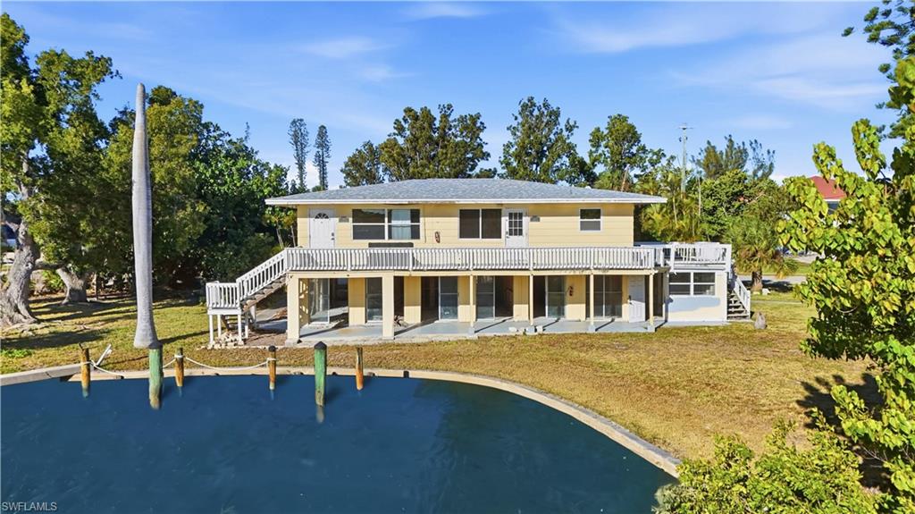 75 Mound Road Fort Myers Beach, FL 33931 - Photo 5 of 20 a view of a house with a swimming pool