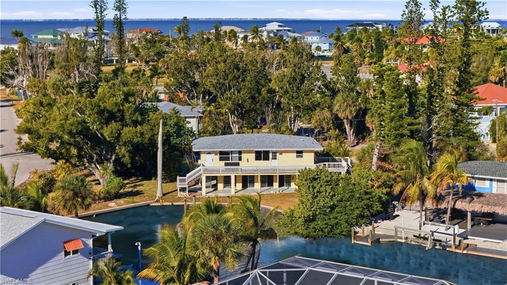 75 Mound Road Fort Myers Beach, FL 33931 - Photo 8 of 20 an aerial view of a house with a yard