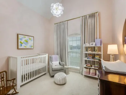 a bedroom with furniture and a window