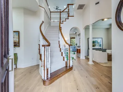 a view of a hallway view with staircase