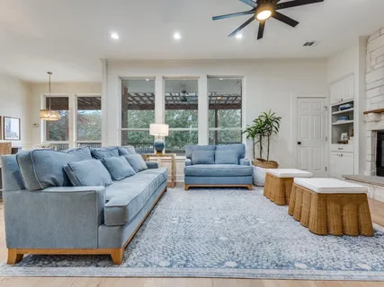 a living room with furniture and a rug