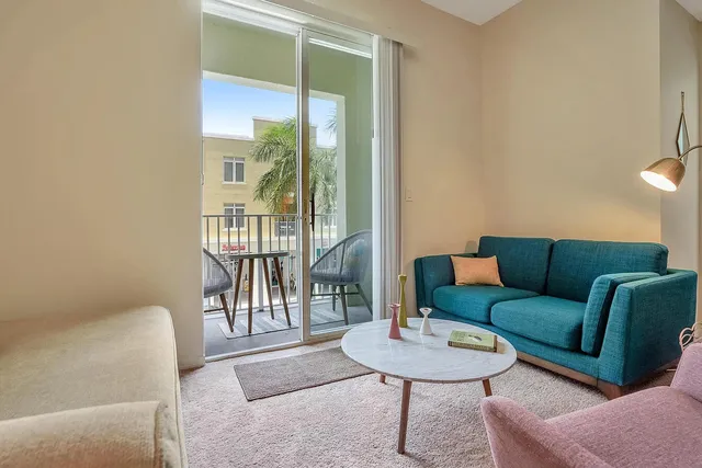 a living room with furniture and a table
