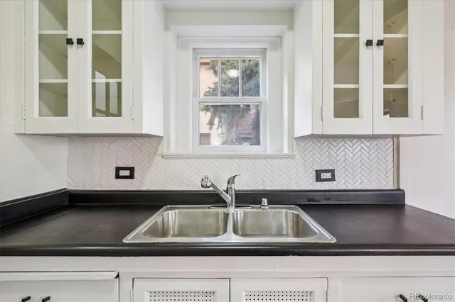 a kitchen sink with a window
