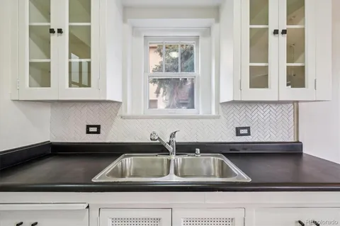 a kitchen sink with a window