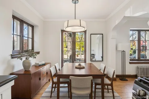 a view of a dining room with furniture window and outside view