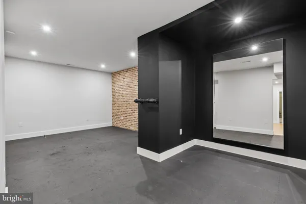 a view of a hallway with wooden shelves