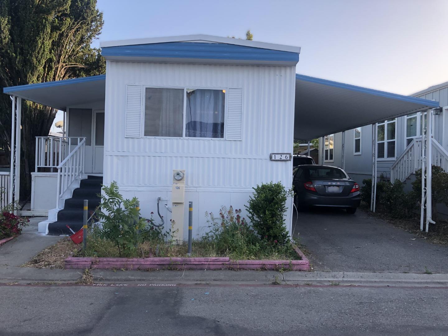 a car parked in front of a house
