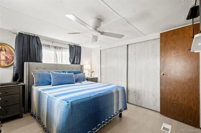 a bed room with a bed and a television