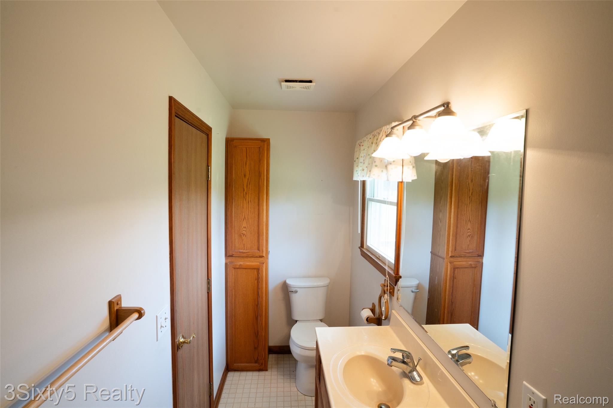 1783 Farnsworth Road Lapeer, MI 48446 - Photo 32 of 51 Bathroom with toilet and vanity