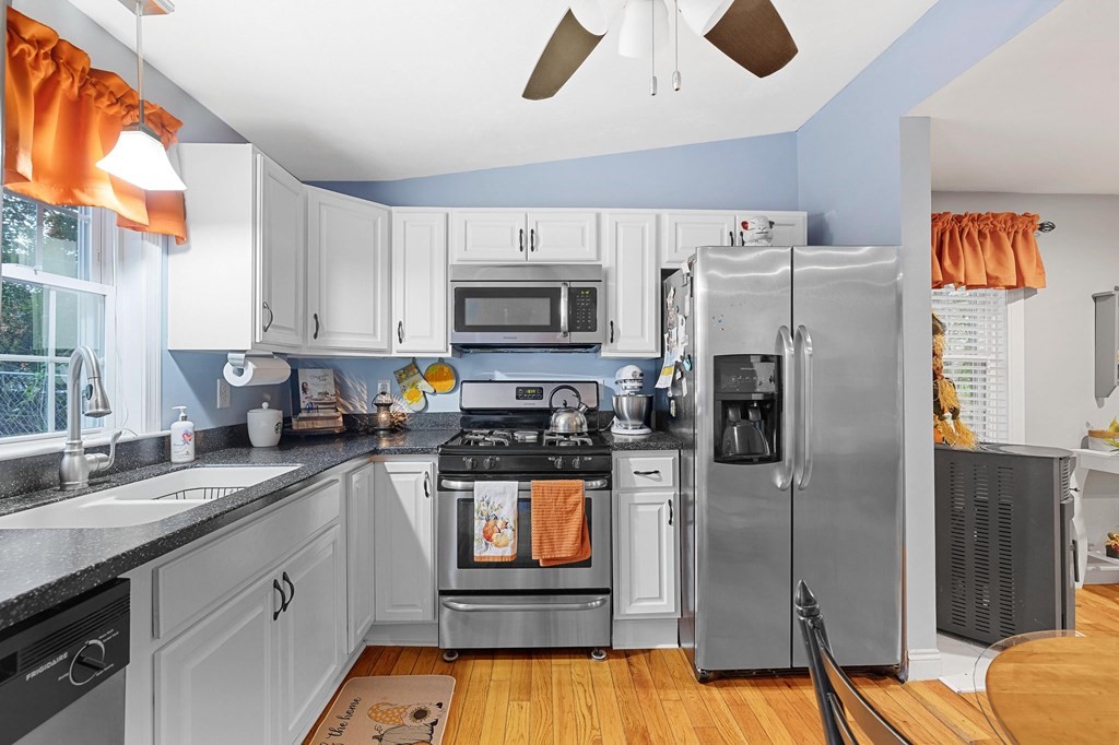 31 Reid Road Douglas, MA 01516 - Photo 11 of 31 a kitchen with stainless steel appliances granite countertop a refrigerator a stove top oven a sink and dishwasher