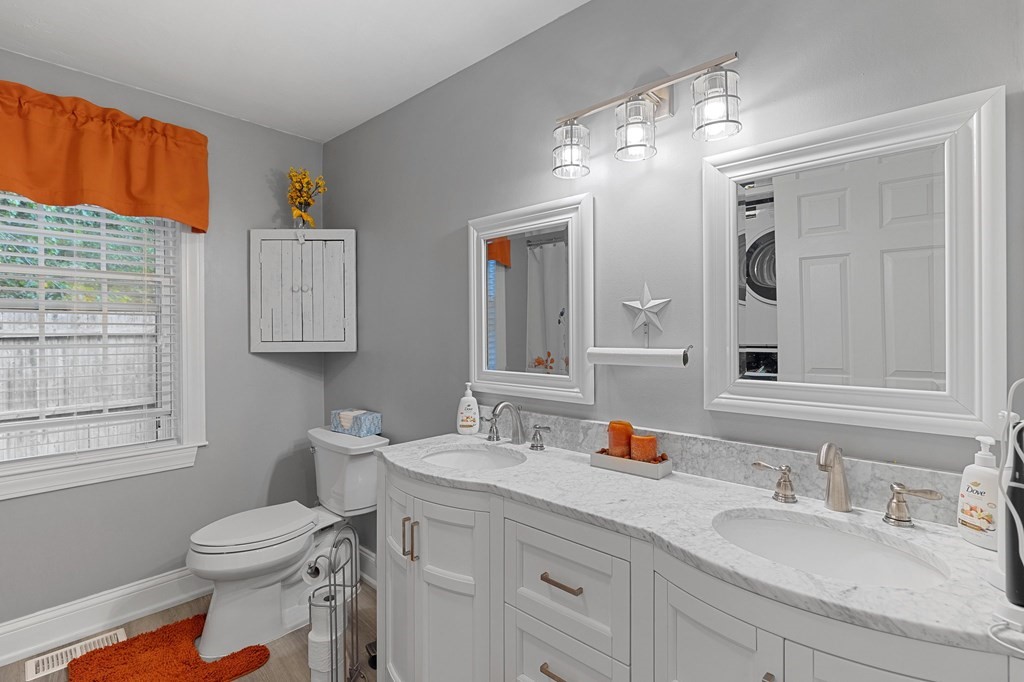 31 Reid Road Douglas, MA 01516 - Photo 13 of 31 a bathroom with a granite countertop sink mirror vanity and a toilet