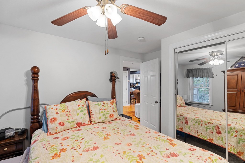 31 Reid Road Douglas, MA 01516 - Photo 15 of 31 a bedroom with a bed and a large mirror with the dresser
