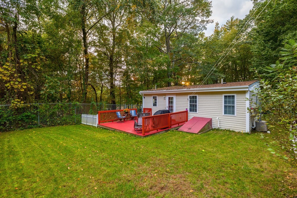 31 Reid Road Douglas, MA 01516 - Photo 22 of 31 a view of a house with backyard and a hammock