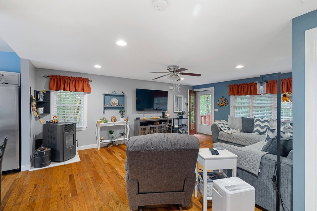 31 Reid Road Douglas, MA 01516 - Photo 6 of 31 a living room with furniture a flat screen tv and a table