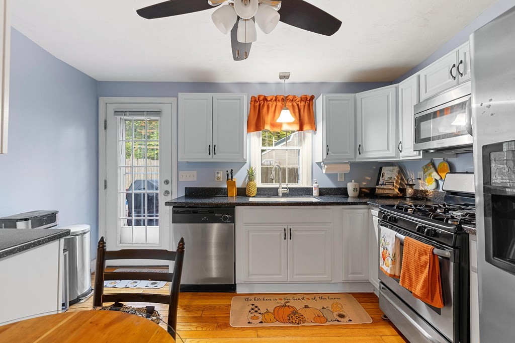 31 Reid Road Douglas, MA 01516 - Photo 10 of 31 a kitchen with stainless steel appliances granite countertop a stove and a sink