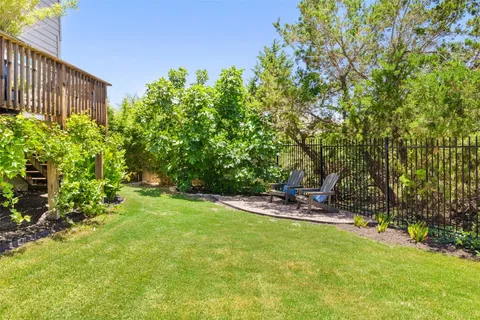 a view of a backyard with sitting area