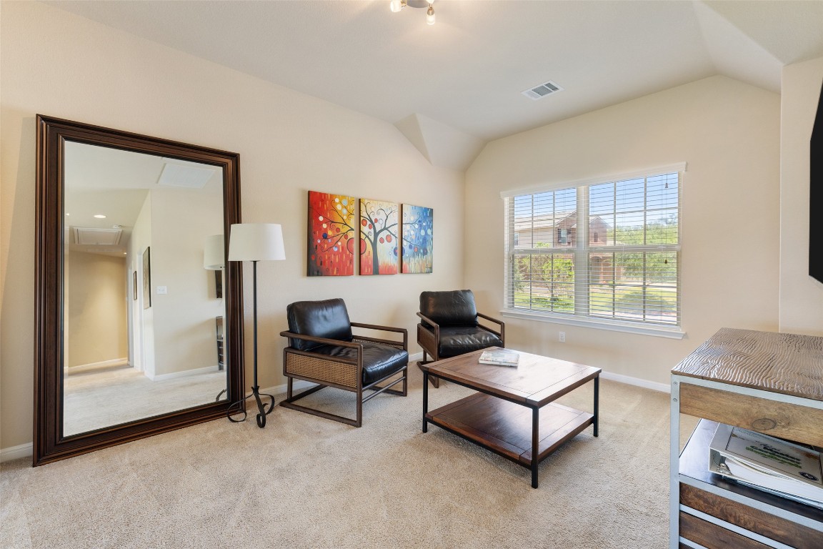 609 Stone View Trail Austin, TX 78737 - Photo 24 of 36 a living room with furniture and a window