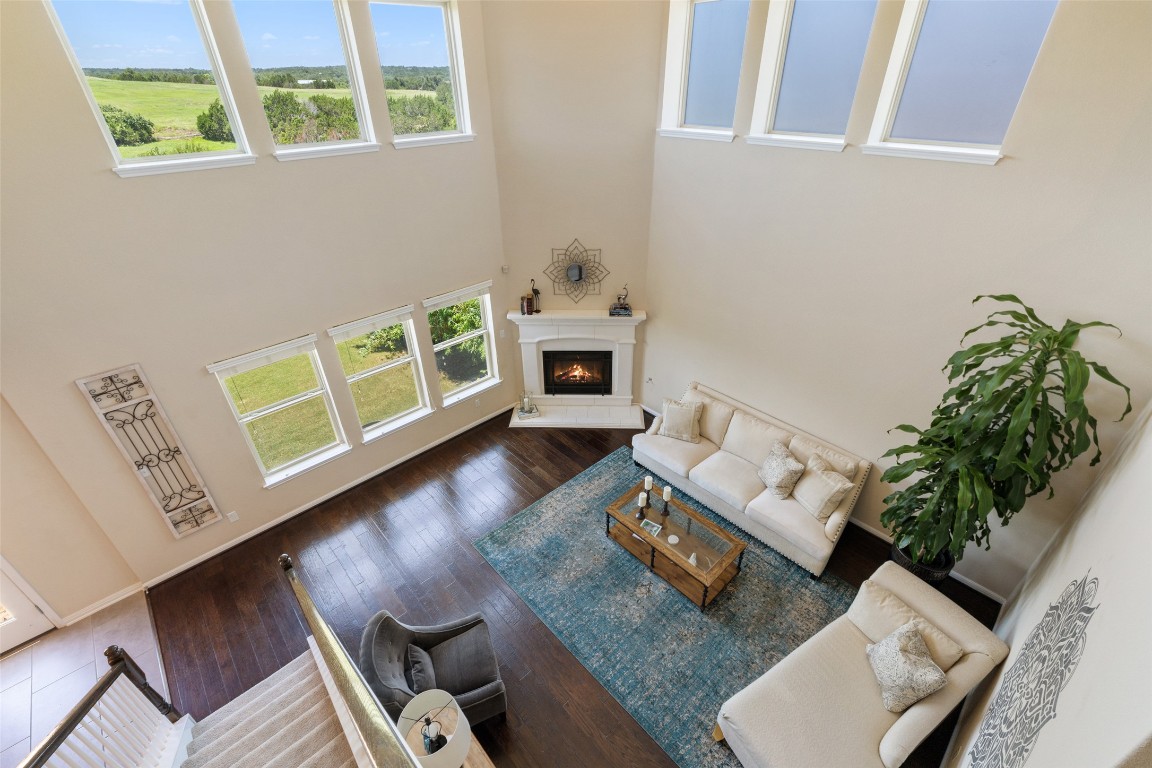 609 Stone View Trail Austin, TX 78737 - Photo 27 of 36 a living room with furniture and a fireplace