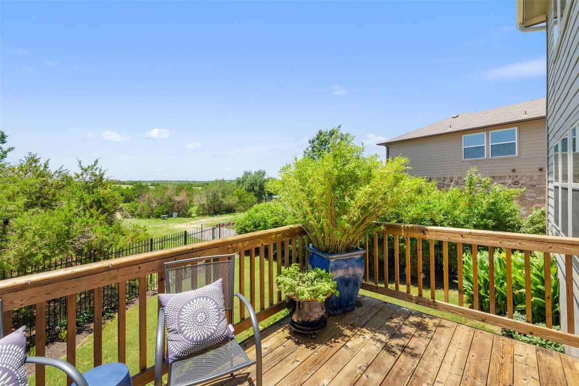 609 Stone View Trail Austin, TX 78737 - Photo 28 of 36 a balcony with wooden floor and outdoor seating