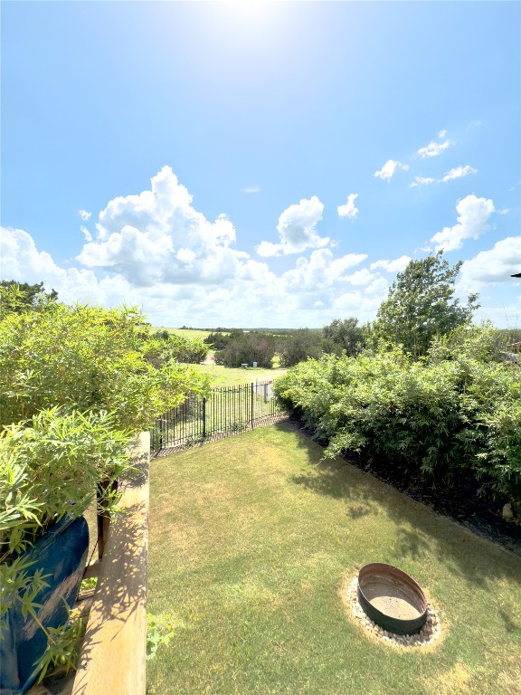 609 Stone View Trail Austin, TX 78737 - Photo 34 of 36 a view of a swimming pool with an outdoor seating and a yard