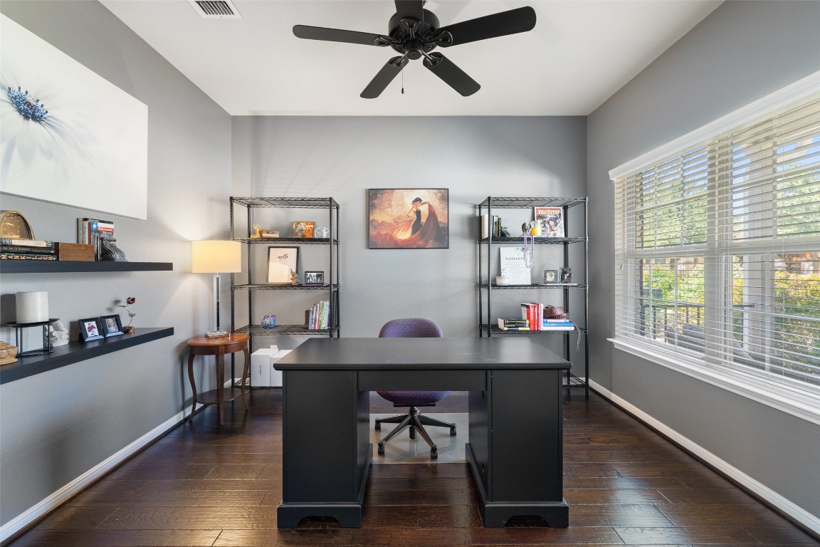 609 Stone View Trail Austin, TX 78737 - Photo 4 of 36 a workspace with furniture window and wooden floor