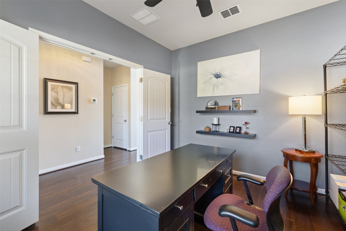 609 Stone View Trail Austin, TX 78737 - Photo 5 of 36 a view of a workspace with furniture and wooden floor