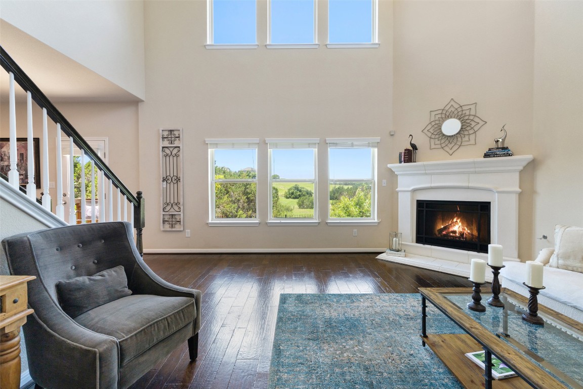 609 Stone View Trail Austin, TX 78737 - Photo 8 of 36 a living room with furniture and a fireplace