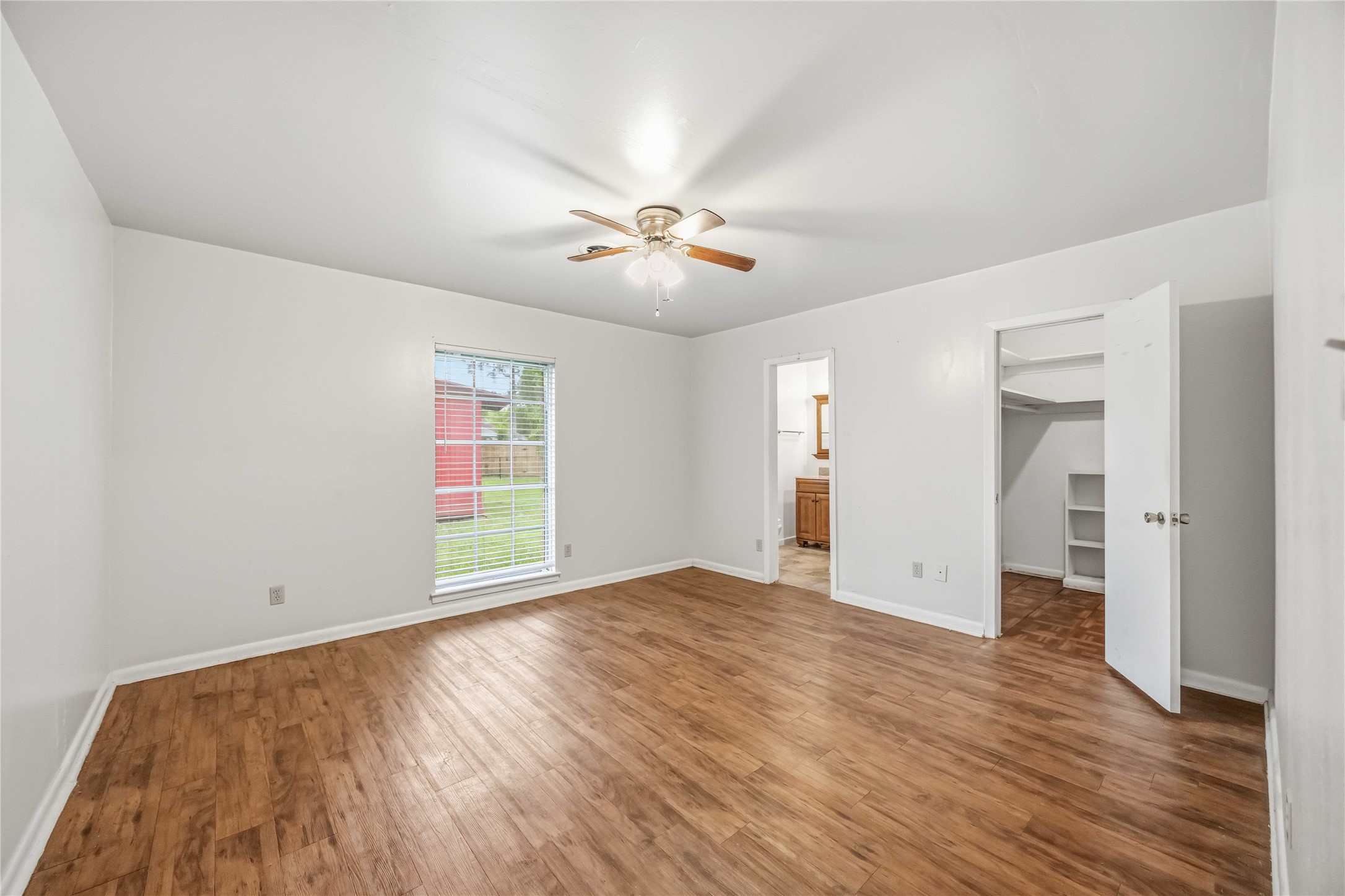 435 Rolling Wood Road Baytown, TX 77520 - Photo 21 of 29 Primary bedroom large enough for King size bedroom set overlooking the large backyard