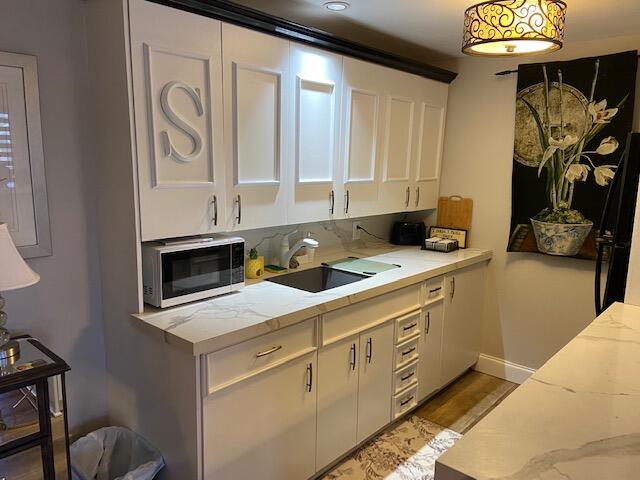 4029 Cornwall East Boca Raton, FL 33434 - Photo 5 of 20 a kitchen with stainless steel appliances granite countertop a sink a stove and a microwave