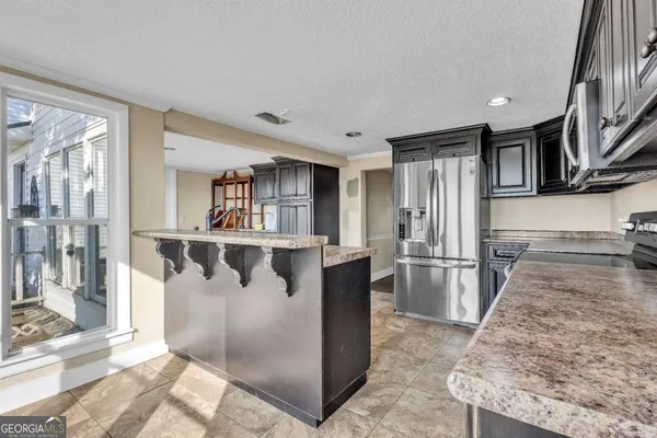 a view of a kitchen from the hallway