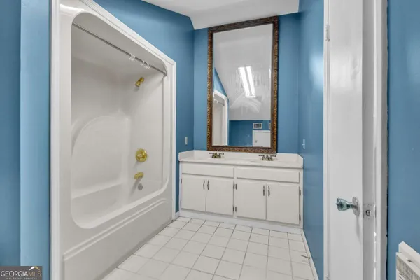 a bathroom with a bathtub and a toilet