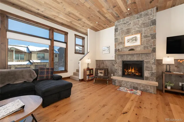 a kitchen with stainless steel appliances granite countertop a refrigerator a stove and a sink