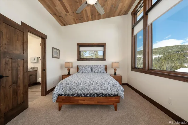 a bedroom with a large bed and a large window